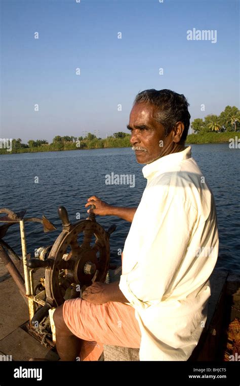 Kerala southern india backwater houseboat trip captain Stock Photo - Alamy