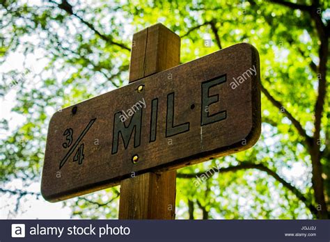 A Trail Sign That Read 34 Mile Live Life One Mile At A Time