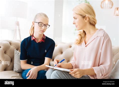 Nice Female Psychologist Taking Notes Stock Photo Alamy