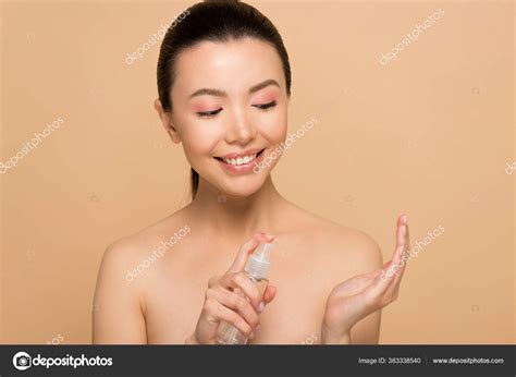 Attractive Happy Nude Asian Woman Using Antiseptic Spray Isolated Beige Stock Photo By