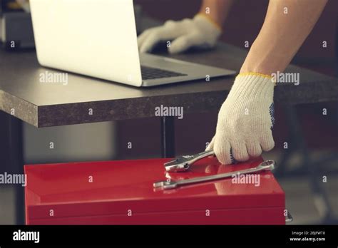 Hand Of Auto Mechanic Selecting Tool In Car Repair Shop Stock Photo Alamy