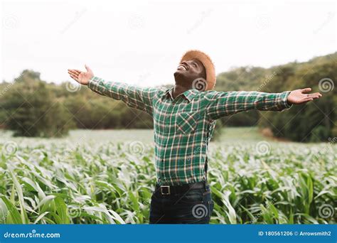 Freedom African Farmer Man Stand At The Green Farm With Happy And Smile