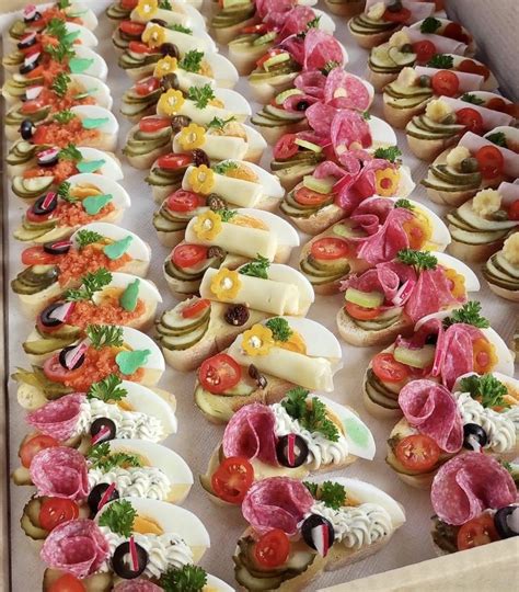 An Assortment Of Appetizers Are Displayed In A Box