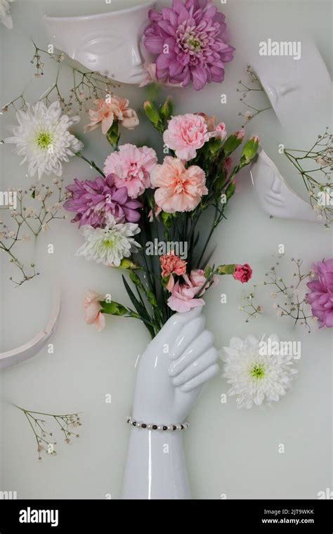 Hand Vase Holding Flowers Stock Photo Alamy