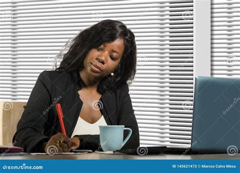 Young Beautiful And Busy Black African American Businesswoman Writing