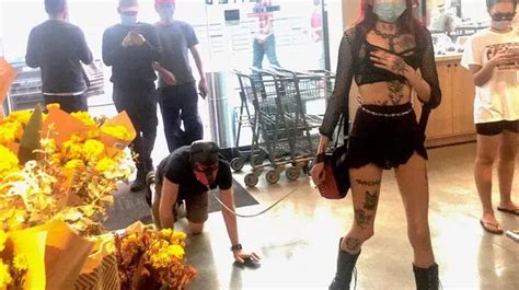 Dominatrix Photographed Leading Man On Leash Around Busy Supermarket