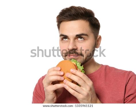 Handsome Man Eating Tasty Burger Isolated Stock Photo 1335961121