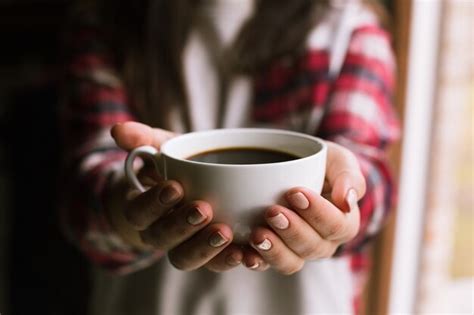 Premium Photo Hands Holding Hot Cup Of Coffee In Morning