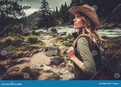 Beautiful Woman Hiker Enjoying Amazing Landscapes Near Wild Mountain