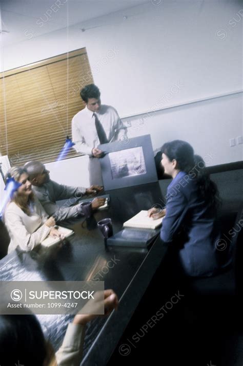 Businessman Giving A Presentation In A Meeting Superstock