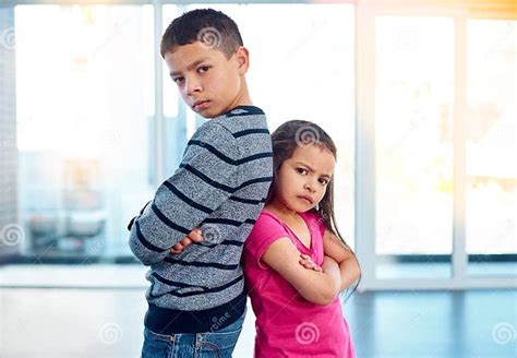 Anger Brother And Portrait Of Sister With Arms Crossed In Home