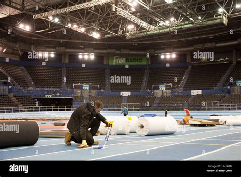 Workers Laying The New Infield Track At The National Indoor Arena In