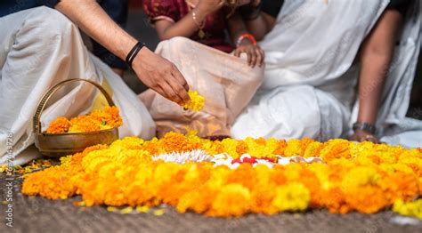 Kerala Onam festival image, Indian family making Onam Pookalam with ...