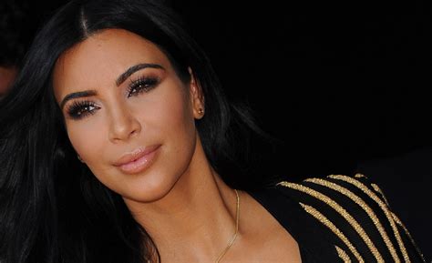 See Kim Kardashian Shows Her Face For The First Time After Giving Birth Photos