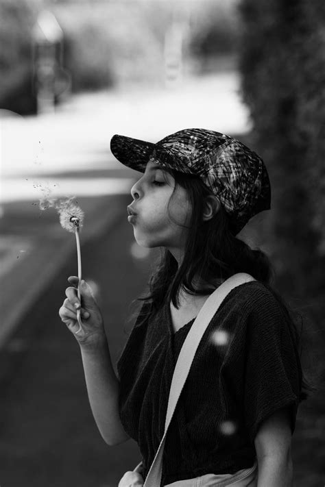 Girl Blowing On Dandelion Clock · Free Stock Photo