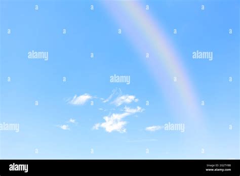 Rainbow on the clear sky . Sunny sky after rain Stock Photo - Alamy