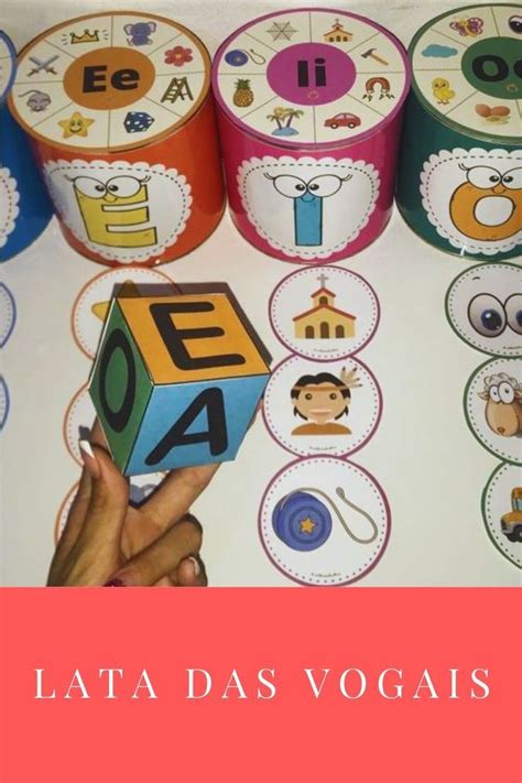 A Person Holding A Toy In Front Of Some Stickers With Letters And