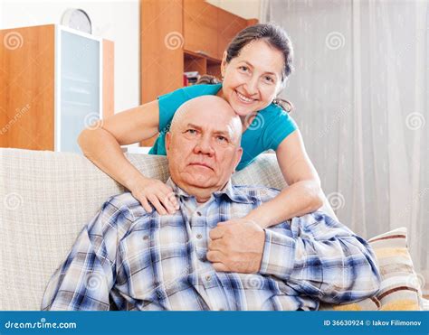 Cheerful Mature Woman With Elderly Husband Stock Photo Image Of Couch