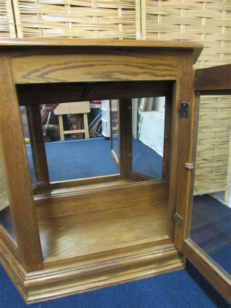 Lot Detail Lighted Oak Curio Cabinet With Mirrored Back