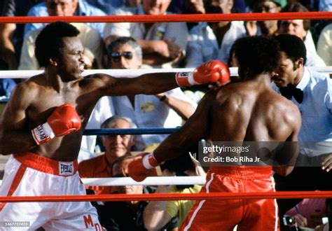 Boxer Michael Dokes Battles Mike Weaver During Championship Fight