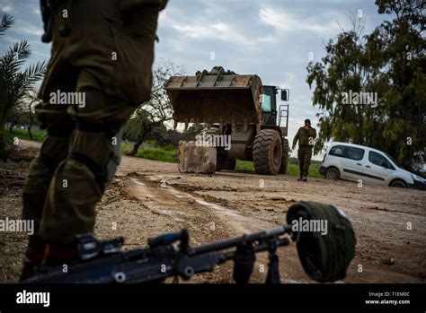 26 March 2019, Israel, Nahal Oz: An Israeli soldier stands next to his ...