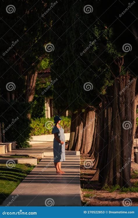 Romantic Middle Aged Pregnant Woman In Pine Forest Concept Of Travel