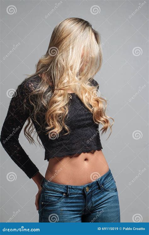 Portrait Of A Beautiful Blonde Woman Hiding Behind Her Hair Stock Image Image Of Hispanic
