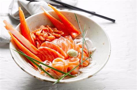 Premium Photo Salmon Sashimi And Imitation Crab Stick In Japanese Style With Kimchi Wasabi