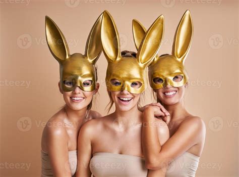 Group Of Beautiful Women Wearing Bunny Ears Isolated Over Background