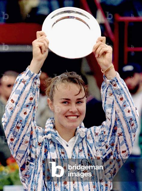 Image Of Swiss 15 Year Old Martina Hingis Holds Up Her Second Placed Trophy