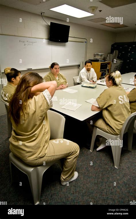 Uniformed women jail inmates participate in a drug treatment seminar ...