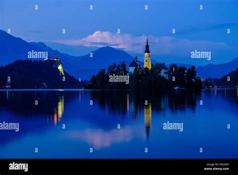 Illuminated Bled Island Blejski Otok With The Pilgrimage Church