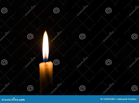 The Concept Of Mourning A Burning Candle With Smoke On A Black