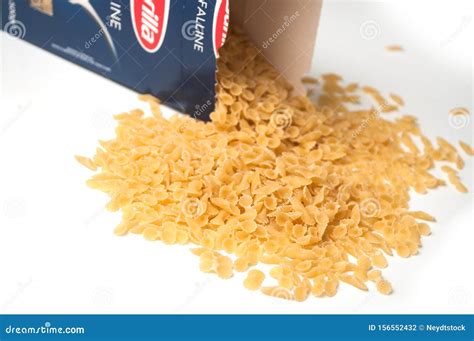 Closeup Of Farfalle Pasta Falling From Barilla Cardboard Box On White Background The Famous