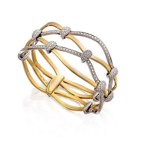 18ct Two Tone Gold And Diamond Bangle Of Hinged Design The