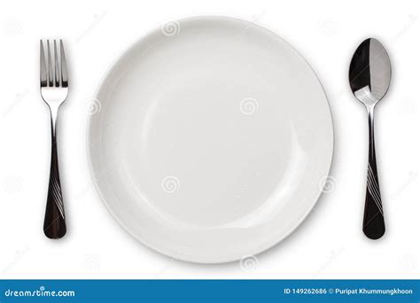 Dinner Place Setting A White Plate With Silver Fork And Spoon Isolated