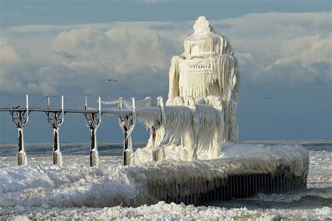 winter hits st. joseph lighthouse, michigan lake photo | One Big Photo