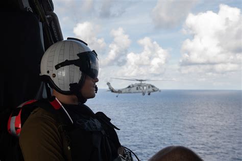 DVIDS Images U S Navy Naval Aircrewman Flies Adjacent To An MH 60S