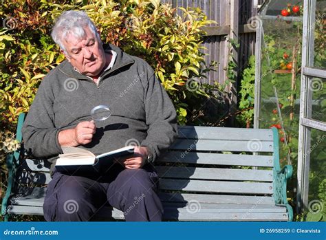 Elderly Man Reading With Magnifying Glass Stock Image Image Of Book