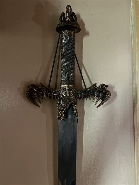 Hoping to identify some replica swords! : r/SWORDS