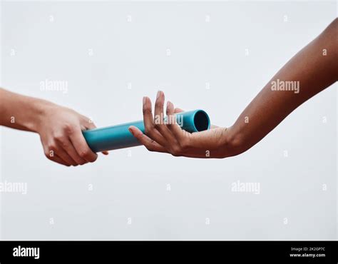 Relay Athletes Passing A Baton Hi Res Stock Photography And Images Alamy