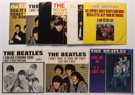 454 A Collection Of Beatles 45 Rpm Records And Sleeves