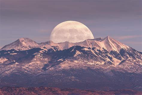 Full Moon Rising Behind La Sal Mountains In Canyonlands National Park