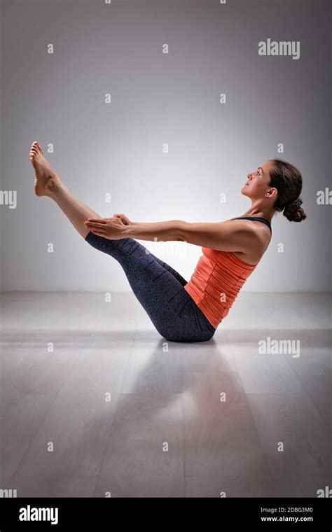 Beautiful Sporty Fit Yogini Woman Practices Yoga Asana Paripurna