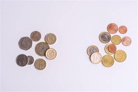 Premium Photo High Angle View Of Coins Against White Background