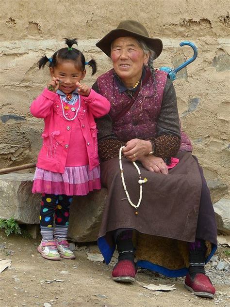 "Cheese", smile for the camera | Tibetan girl and grandmother at the ...