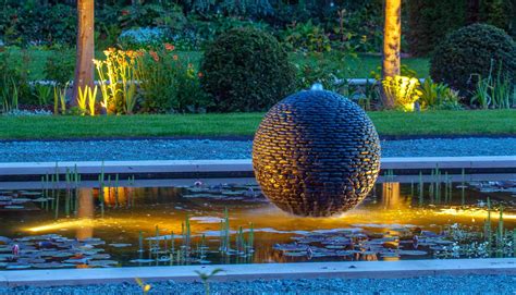 Stone Sphere Water Feature | Water Fountain Ball of Black Pebbles