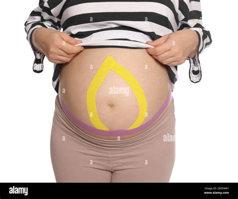 Pregnant Woman With Kinesio Tapes On Her Belly Against White Background