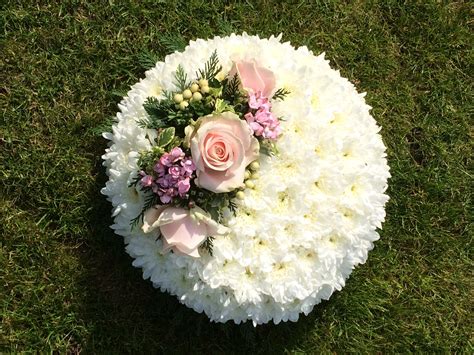 Funeral posy pad - white chrysanthemum based with pretty floral spray ...