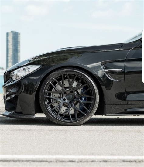 Black BMW M3 in Cityscape